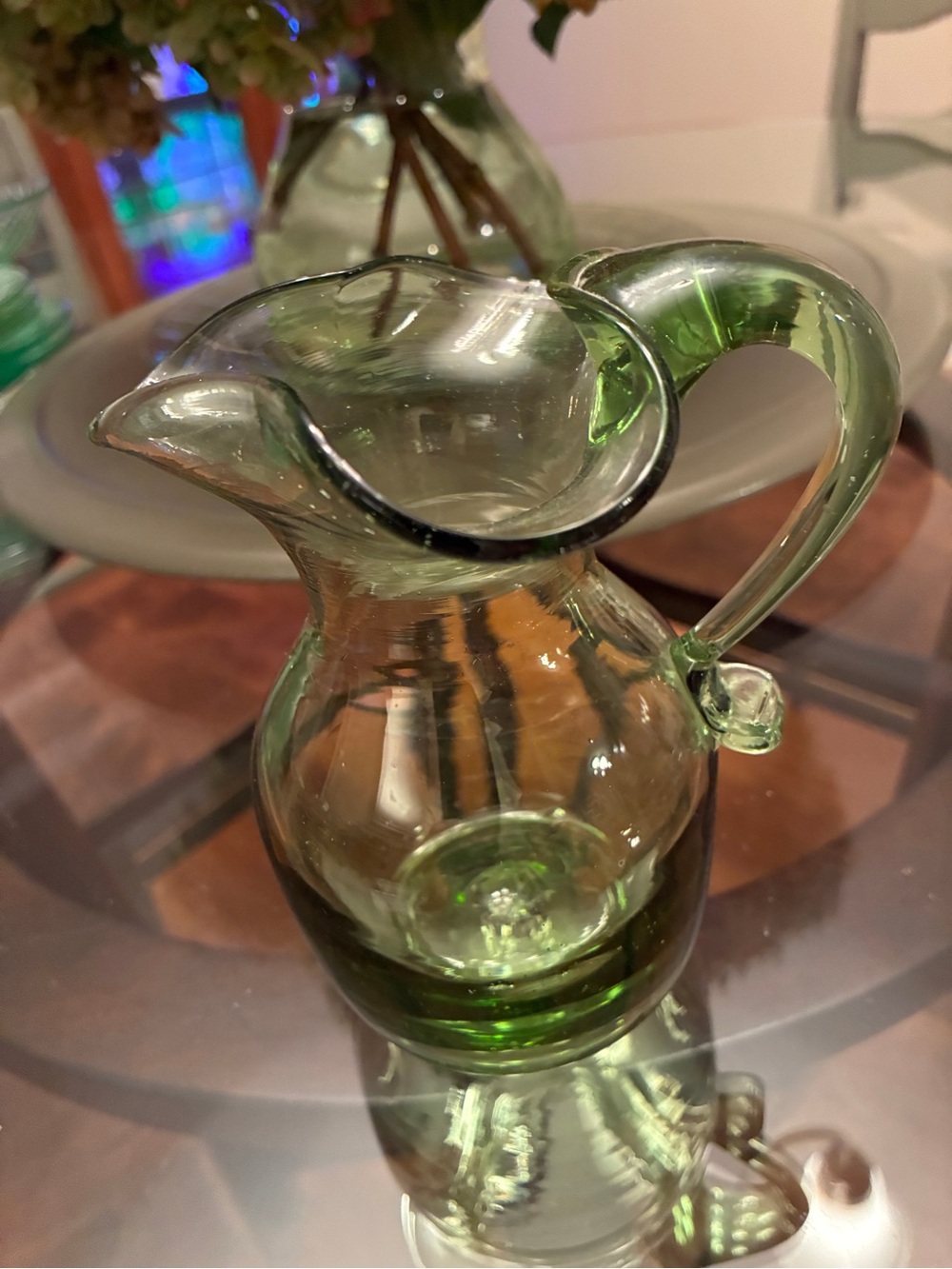 Vintage hand blown green glass pitcher, @5 in x 3 in